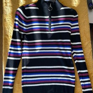 Black, pink, blue and white turtle neck sweater